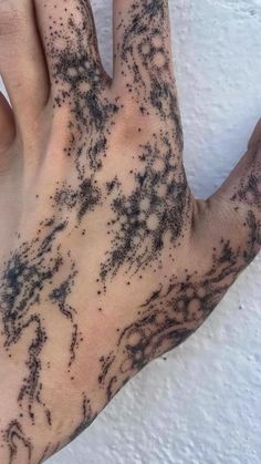 a person's hand with black ink on it