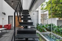 the stairs lead up to the second floor in this modern house with glass railings