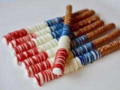 an american flag made out of pretzels and candy canes on a white surface