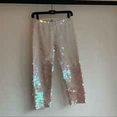 Rosa Bloom Indus Sequin Leggings - Iridescent White Our Sequin Leggings Deliver Unparalleled Sparkle. They Will Swathe Your Legs With Thousands Of Iridescent Sequins, All Hand-Stitched Onto A Comfortable Stretchy Organic Cotton Fabric. Plus, They’re Unisex. Spring Sequined Metallic Pants, Metallic Sequined Pants For Spring, Spring Fitted Shimmer Pants, Fitted Shimmer Pants For Spring, Fitted Shimmer Bottoms For Spring, Sequin Leggings, Iridescent White, Organic Cotton Fabric, Hand Stitched