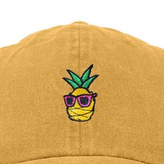 Get ready for summer days with our Pineapple Paradise cap! This fun and tropical pineapple adds a touch of whimsy to any outfit, perfect for sunny days ahead. Discover the perfect blend of style and comfort with our classic dad cap, tailored to fit effortlessly into your everyday wardrobe. This timeless hat features a convenient adjustable slider at the back, ensuring a customizable fit for all head sizes. Designed with functionality in mind, the cap includes eyelet holes for enhanced breathabil Yellow Dad Hat For Summer, Yellow Dad Hat Baseball Cap For Summer, Brimmed Dad Hat For Summer Beach, Casual Flat Bill Dad Hat For Beach, Cool Dad Hats, Straw Panama Hat, Straw Visor, Get Ready For Summer, Embroidered Cap