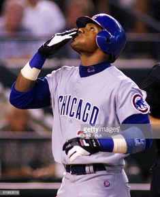 the chicago cubs player is drinking from his mouth