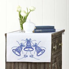 a table with some flowers and books on it