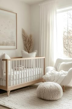 a white crib in the corner of a room next to a window with curtains