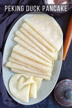 several pieces of flat bread on a plate next to some salt and pepper shakers