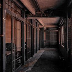 an old jail cell with bars on the doors