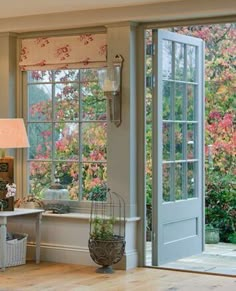 a living room filled with furniture and windows