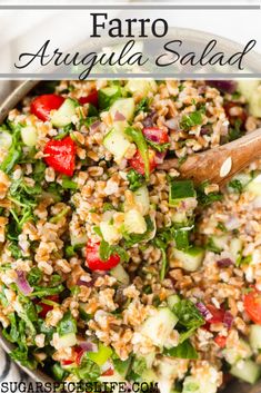 faro salad in a bowl with a wooden spoon