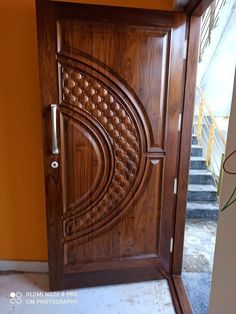 a wooden door with an intricate design on it