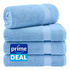 four blue towels stacked on top of each other with the prime deal sticker above them