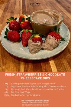 fresh strawberries and chocolate cheesecake dips are served on a plate with strawberry slices