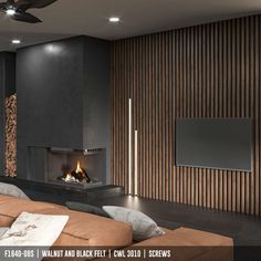 a living room with a couch, fireplace and flat screen tv mounted on the wall