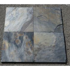 four different types of slate tiles laid out on the ground, one is blue and gray