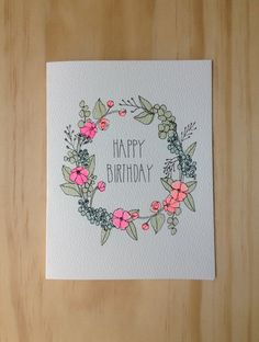 a birthday card with flowers and leaves on it