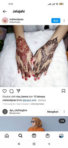 an image of someones hands with henna tattoos on their palms and fingers,