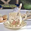 a cup and saucer sitting on top of a table next to a plate with cookies