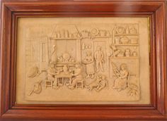 this is an image of a wood carving in the shape of a kitchen with people cooking