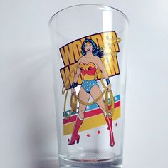 a glass with a wonder woman on it