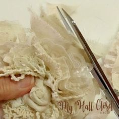 a pair of scissors being used to sew lace on fabric with the words, my fall close