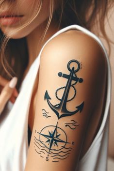 a woman with a tattoo on her arm and an anchor in the middle of it