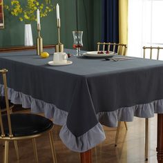 a dining room table with plates and cups on it