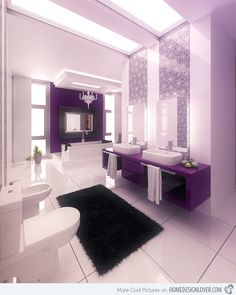 a bathroom with two sinks and purple accents