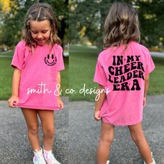 two girls in matching pink shirts and white sneakers