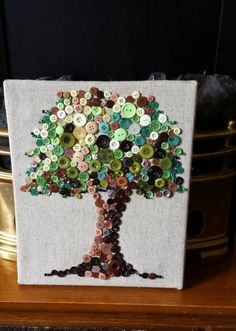 a tree made out of buttons sitting on top of a table