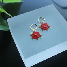 "Celebrate the holiday season with these lightweight and eco-friendly 3D printed Poinsettia earrings! Each meticulously crafted Poinsettia flower captures the natural beauty while maintaining an eco-conscious approach. These charming earrings are a delightful addition to your festive look.  🌼 Product Details: Earring Length: Drops approximately 1 1/2 inches (3.8 cm) Pendant Size: Approximately 3/4 inch (1.9 cm) Material: 3D Printed Eco-Friendly Bioplastic Hoop Material: Gold-Plated Stainless St Poinsettia Earrings, Green And Red Christmas, Mom Earrings, Football Earrings, Christmas Tree Earrings, Poinsettia Flower, Earrings And Necklace, Christmas Accessories, Christmas Flowers