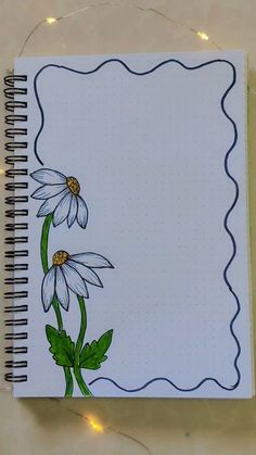 a notebook with some flowers on it