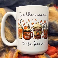 a white coffee mug that says tis the season, pumpkin spice to be basic