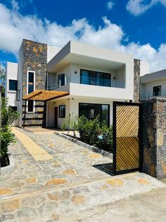 a modern house with stone and wood accents