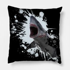 a shark with its mouth open and it's teeth splattered on the pillow