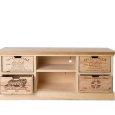 a wooden entertainment center with drawers and wine boxes on it's sides, in front of a white background