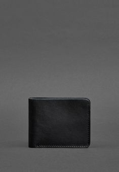 Sophisticated Leather Wallet for Men with a Timeless Design Classic Black Trifold Wallet For Everyday, Classic Black Trifold Wallet For Everyday Carry, Classic Trifold Wallet For Everyday Carry, Modern Black Wallets For Business, Classic Black Trifold Wallet For Business, Modern Wallets With Leather Lining For Everyday Use, Minimalist Black Trifold Wallet As Gift, Minimalist Trifold Wallet For Everyday, Classic Black Trifold Wallet As Gift