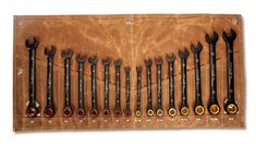 a leather case filled with wrenches and other tools