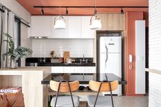 the kitchen is clean and ready to be used as a living room or dining area