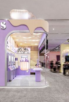 the inside of a store with purple walls and white trimmings on the doors