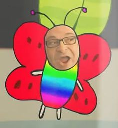 a man in glasses is making a face with a colorful butterfly on his chest and tongue