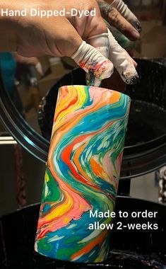 a hand dipped - dyed cake is being made to order