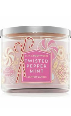 bath and body works twisted peppermint scented candle in a glass jar with candy canes