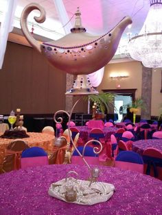 an elaborately decorated dining room with purple linens