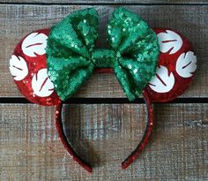 a minnie mouse ears with green and red sequins