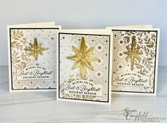 three cards with gold foil stars on them