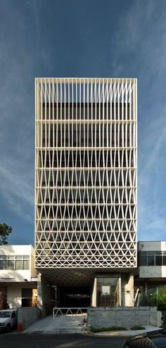 the building is designed to look like it has been made out of white squares and lines