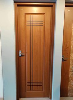 a wooden door with metal bars on the front and side panels in an office building