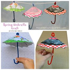 an umbrella made out of paper is hanging from a clothes line and has the words spring umbrella craft on it