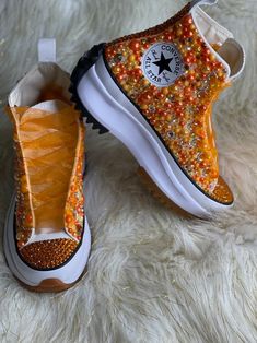 Custom Pearls & Bling Converse All designs handmade and embellished with a variety of high quality crystals. Good for weddings, proms, homecomings, birthdays, special events or just your everyday girly girl. Shoe Details: Orange Run Star Hike Converse (Platform Style) Shoe Size: starting at women's size 6 to women's size 12; Size availability may vary based on our suppliers current inventory. If your size is out of stock at the time of your order we will notify you within 48 hours. ** PLEASE NOT Star Hike Converse, Hike Converse, Run Star Hike Converse, Rhinestone Converse, Bedazzled Shoes Diy, Shoe Hacks, Bedazzled Shoes, Custom Sneakers Diy, Tie Sneakers