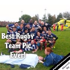 a group of people standing around each other on top of a grass field with the words best rugby team pic ever