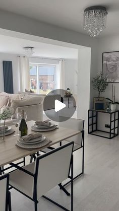 a living room filled with furniture and a dining table